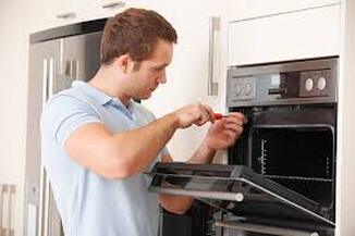 Electrician installing microwave oven